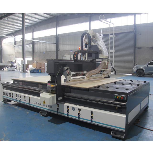 Industrial CNC router processing wooden cabinet panels automatically